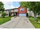Two-story home with brick and vinyl siding, well-kept lawn, and two-car garage at 3316 Gainesville Ct, Indianapolis, IN 46227