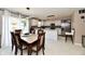 Bright, open kitchen featuring modern appliances, stylish backsplash, and an adjacent dining area at 3316 Gainesville Ct, Indianapolis, IN 46227