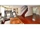 Inviting living room with hardwood floors and leather sofas, and open layout to dining and kitchen at 3316 Gainesville Ct, Indianapolis, IN 46227