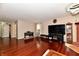 Living room with hardwood floors, fireplace, media center, and an electric keyboard at 3316 Gainesville Ct, Indianapolis, IN 46227