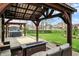 Beautiful backyard featuring covered seating, hot tub and views of the neighborhood at 3572 Westmore Cir, Bargersville, IN 46106
