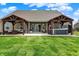 Inviting backyard featuring a hot tub, two covered seating areas and lush green lawn, perfect for outdoor living at 3572 Westmore Cir, Bargersville, IN 46106