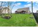 Spacious backyard with a lush lawn, mature trees, and black wrought iron fence provides privacy at 3572 Westmore Cir, Bargersville, IN 46106