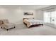 Large bedroom featuring a stylish accent chair, picture window, and a queen bed at 3572 Westmore Cir, Bargersville, IN 46106