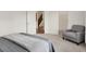Bright bedroom featuring a cozy chair, and a glimpse into the hallway and closet at 3572 Westmore Cir, Bargersville, IN 46106