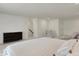 Spacious bedroom with a comfortable bed, dresser, staircase, and sitting area at 3572 Westmore Cir, Bargersville, IN 46106
