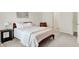Well-lit bedroom featuring a wooden bed frame, accent chair, and large window at 3572 Westmore Cir, Bargersville, IN 46106