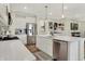 Kitchen with stainless steel appliances, white cabinets, and an island with a sink and a stainless-steel dishwasher at 3572 Westmore Cir, Bargersville, IN 46106