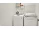 Laundry area with modern front load washer and traditional top load dryer at 3572 Westmore Cir, Bargersville, IN 46106