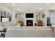 Comfortable living room featuring a fireplace, plush seating, and neutral decor at 3572 Westmore Cir, Bargersville, IN 46106
