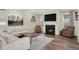 Cozy living room featuring a fireplace, plush seating, and neutral decor at 3572 Westmore Cir, Bargersville, IN 46106