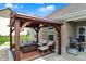 Covered outdoor seating area with comfortable furniture, perfect for relaxing and entertaining at 3572 Westmore Cir, Bargersville, IN 46106