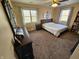 Spacious bedroom with ceiling fan, carpet, and an oversized dresser for a relaxing retreat at 366 E 200 N, Franklin, IN 46131