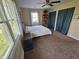 Serene bedroom with a ceiling fan, plush carpet, and ample natural light from large windows with valances at 366 E 200 N, Franklin, IN 46131