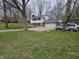 Charming two-story home with a green front lawn, a gravel driveway, and a two car garage at 366 E 200 N, Franklin, IN 46131