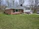 Beautiful exterior view of a brick home with white siding, black shutters, and well-maintained landscaping at 366 E 200 N, Franklin, IN 46131