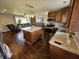 Open kitchen and living area featuring stainless steel appliances, granite countertops, and hardwood floors at 366 E 200 N, Franklin, IN 46131