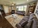 Inviting living room with hardwood floors, large window, neutral paint, comfortable sofas and a ceiling fan at 366 E 200 N, Franklin, IN 46131