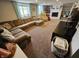 Comfortable living room with a brown carpet and large sectional sofa with blue curtains at 366 E 200 N, Franklin, IN 46131