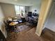 Compact office space with drums, three computer screens, and a wooden desk at 366 E 200 N, Franklin, IN 46131