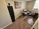 Compact office space with drums, American flag decor, and natural light from a window at 366 E 200 N, Franklin, IN 46131