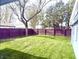 Well-maintained backyard with a lush green lawn and wood privacy fence at 404 W Green St, Lebanon, IN 46052