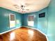 A bright bedroom with hardwood floors, modern ceiling fan, and lots of light at 404 W Green St, Lebanon, IN 46052