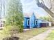 The exterior of the house shows a neat yard, fresh landscaping, and blue painted siding at 404 W Green St, Lebanon, IN 46052