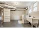 Finished basement with washer, dryer, and wash basin featuring a tiled floor and painted walls at 4151 N Pennsylvania St, Indianapolis, IN 46205