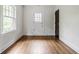 Hardwood flooring and bright natural light in a neutrally decorated room at 4151 N Pennsylvania St, Indianapolis, IN 46205
