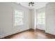 Well-lit bedroom with hardwood floors, and built-in storage at 4151 N Pennsylvania St, Indianapolis, IN 46205