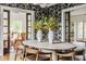 Close-up of dining room showcasing table centerpiece and view into cozy seating area at 4151 N Pennsylvania St, Indianapolis, IN 46205