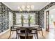 Well-lit dining room with patterned wallpaper and modern orb chandelier at 4151 N Pennsylvania St, Indianapolis, IN 46205