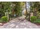 Gated entrance leading to a private driveway with mature trees at 4151 N Pennsylvania St, Indianapolis, IN 46205