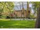 Beautiful brick home with a well-manicured lawn and mature trees at 4151 N Pennsylvania St, Indianapolis, IN 46205