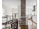 Bright kitchen with brick column, white cabinets, and stainless steel appliances at 4151 N Pennsylvania St, Indianapolis, IN 46205