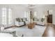 Light-filled living room with hardwood floors and French doors at 4151 N Pennsylvania St, Indianapolis, IN 46205