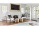 Cozy living room with fireplace, built-in shelving and natural light at 4151 N Pennsylvania St, Indianapolis, IN 46205