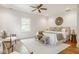 Bright bedroom featuring hardwood floors, stylish furnishings, and lots of natural light at 4151 N Pennsylvania St, Indianapolis, IN 46205