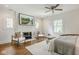 Spacious main bedroom featuring a fireplace, white brick, and lots of natural light at 4151 N Pennsylvania St, Indianapolis, IN 46205