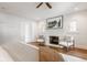 Bright bedroom featuring a white brick fireplace, hardwood floors, and lots of natural light at 4151 N Pennsylvania St, Indianapolis, IN 46205