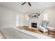 Bright main bedroom with a charming brick fireplace, hardwood floors, and neutral walls at 4151 N Pennsylvania St, Indianapolis, IN 46205