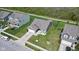 Aerial view of a charming single-Gathering home with a manicured lawn and convenient two-car garage at 4323 Stubbington Ln, Indianapolis, IN 46239