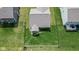Aerial perspective of a single-Gathering home with a fenced backyard and manicured lawn at 4323 Stubbington Ln, Indianapolis, IN 46239