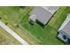 Birds eye view of a home with a fenced yard, lush green lawn, and a well-maintained roof at 4323 Stubbington Ln, Indianapolis, IN 46239