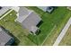 From above, a home sits on a manicured lawn with a fenced backyard and a well-kept roof at 4323 Stubbington Ln, Indianapolis, IN 46239