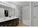 Bathroom with a double vanity sink, black and gold fixtures, and a shower-tub combination at 4323 Stubbington Ln, Indianapolis, IN 46239