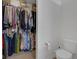 Spacious walk-in closet with ample storage, shelving, and nearby half-bathroom at 4323 Stubbington Ln, Indianapolis, IN 46239