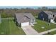 Beautiful single-Gathering home featuring a two-car garage, well-maintained lawn, and charming curb appeal at 4323 Stubbington Ln, Indianapolis, IN 46239