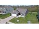 Charming single-Gathering home boasts a well-manicured lawn, attached two-car garage, and inviting curb appeal at 4323 Stubbington Ln, Indianapolis, IN 46239